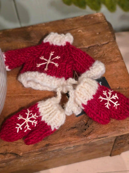 Gestrickter Pullover und Handschuhe Rot